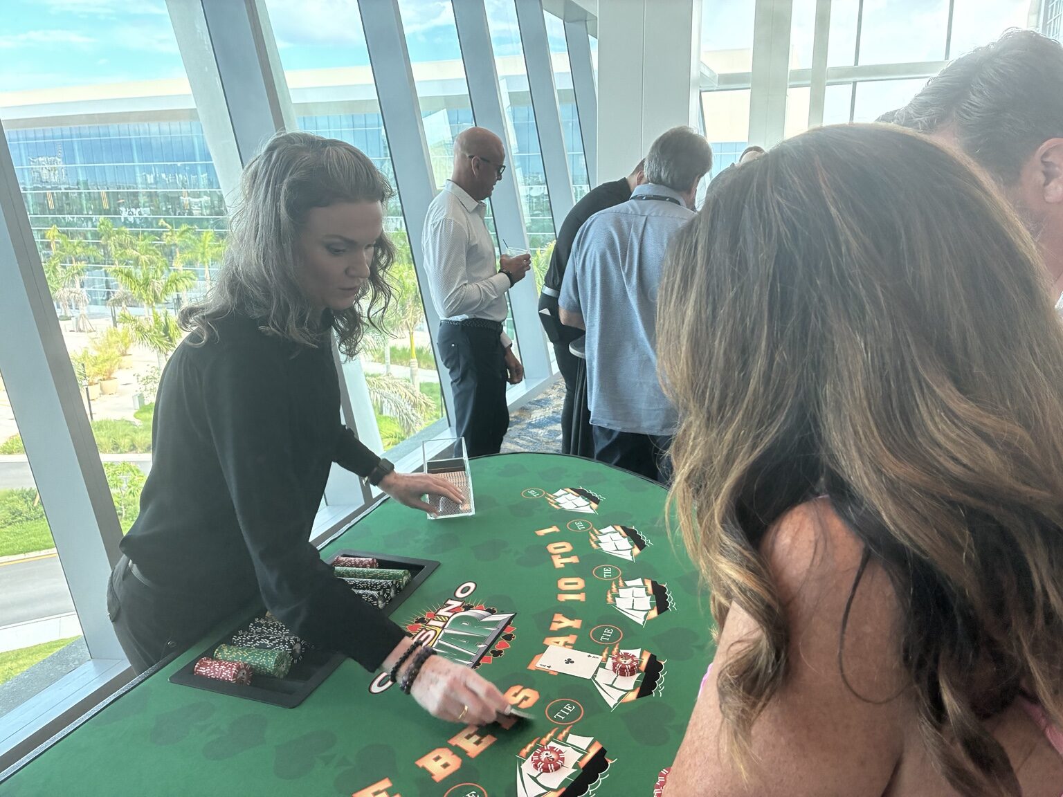 21 Fun Casino War dealer entertaining guests at a casino-themed event