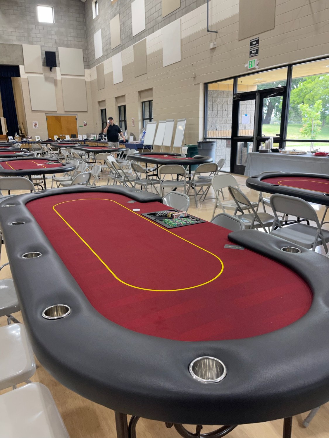 Poker tables arranged and prepared before a tournament