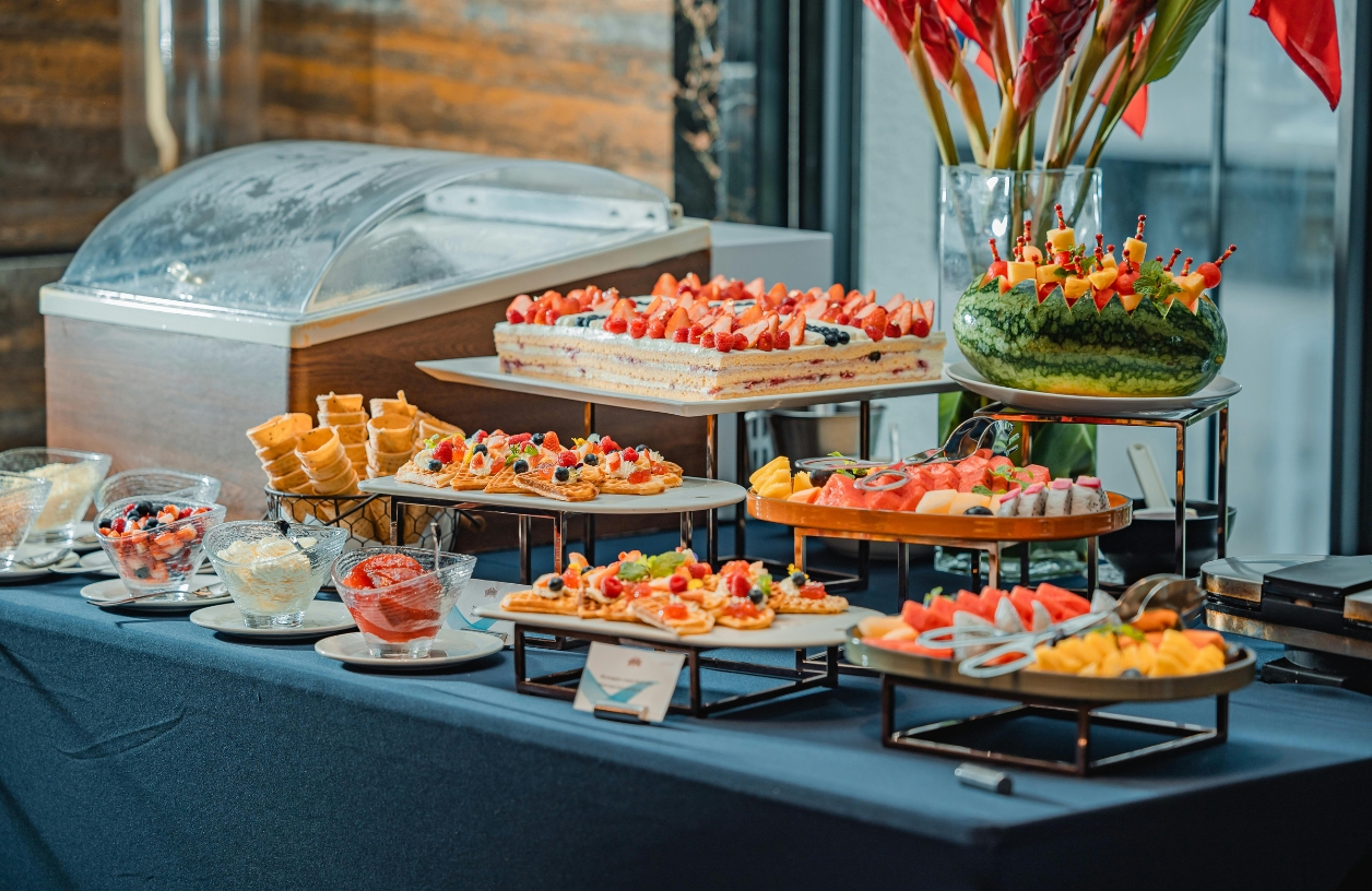 a table spread featuring finger foods including fruits, crackers, cheese, and more snacks perfect for a casino party