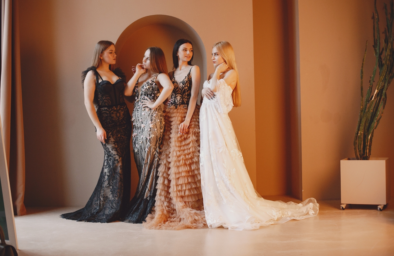 women in elegant evening gowns for a casino themed party