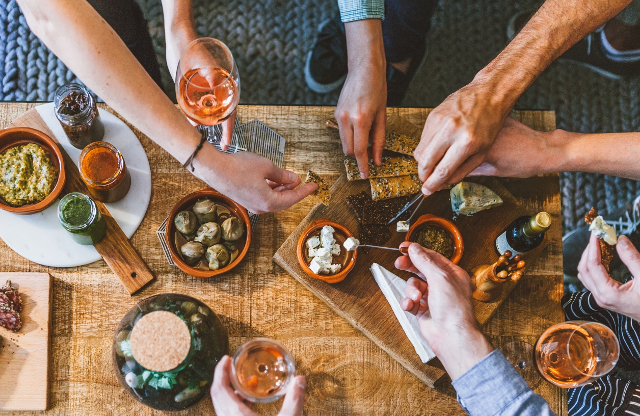 guests enjoying drinks and bite sized foods perfect for casino themed dinner party